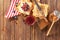 Tasty sweet toasts with jam, honey and fresh berries on wooden table