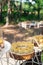 Tasty sweets on a brown rustic wooden banquet table. Summer wedding in the forest. Banquet table.