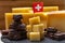 Tasty Swiss food, block of medium-hard yellow cheese emmental or emmentaler with round holes, matured gruyere and high quality