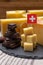 Tasty Swiss food, block of medium-hard yellow cheese emmental or emmentaler with round holes, matured gruyere and high quality