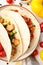 Tasty taco on grey textured background, close up