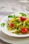 Tasty tagliatelle with basil and tomato