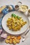 Tasty tagliatelle pasta with basil and green pesto