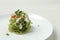 Tasty tagliatelle with spinach and cheese served on white wooden table, closeup. Exquisite presentation of pasta dish
