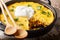 Tasty Tamale pie with corn and ground beef and cheese closeup in a pan. horizontal