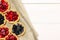 Tasty tartlets with different berries,cranberries,bilberry,blackcurrant . Berry tartlets. Cake with berries. Dessert with berries