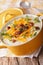 Tasty thick potato soup with bacon and cheddar cheese. Vertical