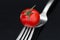 Tasty tomato on forks