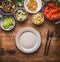 Tasty vegetarian ingredients for healthy meal in bowls: chick peas puree, roasted vegetables , red paprika stew, avocado and seeds