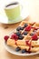 Tasty waffle with fruits