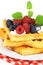 Tasty waffles with summery fruits