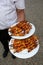 Tasty wedding appetizers served by waiters to guests catering series