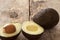 Tasty whole and halved ripe avocado pears