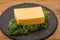Tasty yelloow Tilsiter cheese brick
