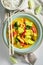 Tasty yellow curry with kaffir leaves, coconut milk and chicken