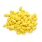 Tasty yellow dragee candies on white background, top view