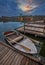 Tata, Hungary - Fishing boat by Lake Derito Derito to with wooden fishing cottages