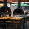 Tatars cooking in ovens at an outdoor cafÃ©