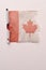 Tattered and torn Canadian flag all ripped graphic photo red and white old looking