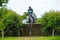 Tattersalls horse show in Ireland, dark grey horse jumping over obstacle with male rider, jockey