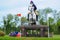 Tattersalls horse show in Ireland, grey horse jumping over obstacle with male rider, jockey