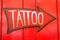 Tattoo sign with large arrow