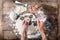 Tattooed chef`s hands cooking russian dumplings on wooden table