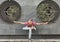 Tattooed man doing yoga pose outdoors over wall