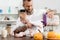 Tattooed man pouring cornflakes into bowl