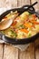 Tatws Pum Munud Five minute potatoes is a traditional Welsh stew, made with smoked bacon, stock, potatoes and carrots closeup in a