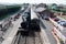 Taunton to Minehead railway station. Steam train and local diesel train alongside the platforms.