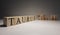 Taurus word on wooden cubes on white background