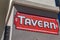 Tavern sign painted in red and white with black outline