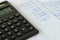 Tax calculation or financial office salary, black calculator on