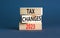 Tax changes 2023 symbol. Concept words Tax changes 2023 on wooden blocks on a beautiful grey table grey background. Business Tax