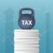 Tax concept with weight of kettlebell on sheets of documents