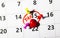 Tax Day 15 April 2020 concept. Reminder calendar with colorful pins and red markings text.