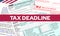 Tax deadline - date of payment of taxes. Red line with the title tax deadline on a blurred background with blanks