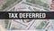 Tax Deferred text Concept Closeup. American Dollars Cash Money,3D rendering. Tax Deferred at Dollar Banknote. Financial USA money