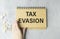 Tax Evasion text on sticky notes isolated