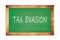 TAX  EVASION text written on green school board