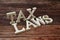 Tax Laws Word alphabet letters on wooden background