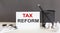 TAX REFORM text and office supplies, business concept