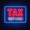 Tax refund neon sign on dark background.