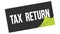 TAX  RETURN text on black green sticker stamp