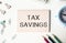 Tax saving text on copybooks page laying.