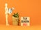 Tax season 2023 symbol. Concept words Tax season 2023 on wooden blocks on a beautiful orange table orange background. Businessman