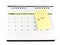 tax time notice message on yellow paper sticky note taped on desk calendar page