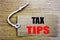 Tax Tips. Business concept for online saleTaxpayer Assistance Refund Reimbursement written on price tag paper with copy space on t