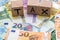 Tax on wooden cubes on euro bills as background